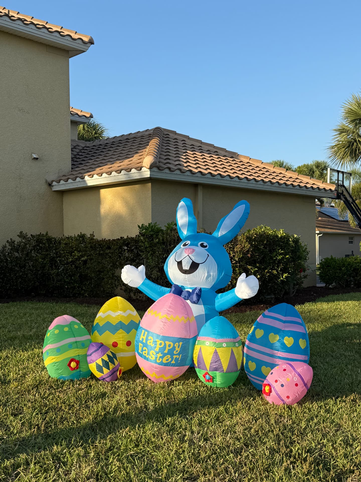 Easter bunny and colorful eggs decorating a Calusa Palms lawn