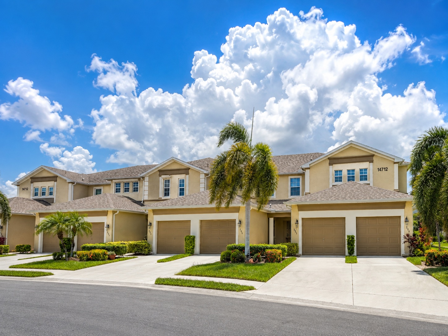Condominium building in Calusa Palms with palms in the foreground